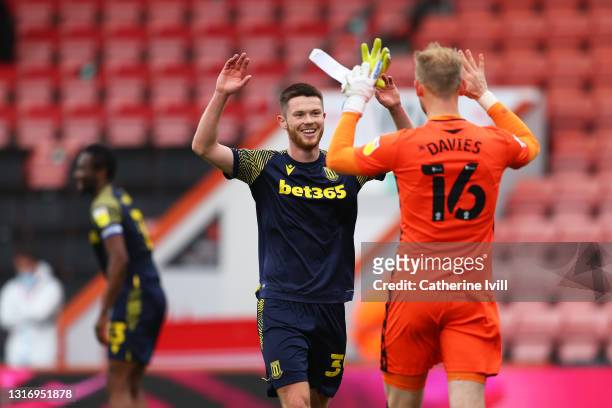 William Forrester and Adam Davies of Stoke City celebrate their side's victory after during the Sky Bet Championship match between AFC Bournemouth...