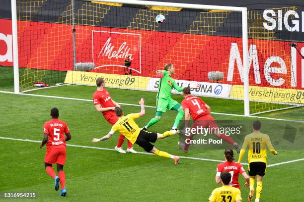 Marco Reus of Borussia Dortmund scores their team's first goal during the Bundesliga match between Borussia Dortmund and RB Leipzig at Signal Iduna...
