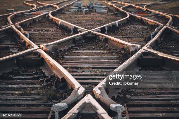 crossing railway tracks. the concept of the beginning of the way, planning, uncertainty of choices and decisions - レール ストックフォトと画像