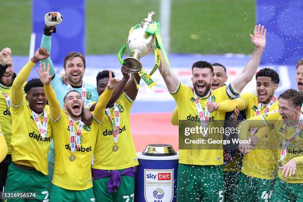 Alexander Tettey and Grant Hanley of Norwich City lift the Sky Bet Championship trophy after the Sky Bet Championship match between Barnsley and...