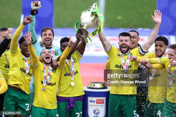 Alexander Tettey and Grant Hanley of Norwich City lift the Sky Bet Championship trophy after the Sky Bet Championship match between Barnsley and...