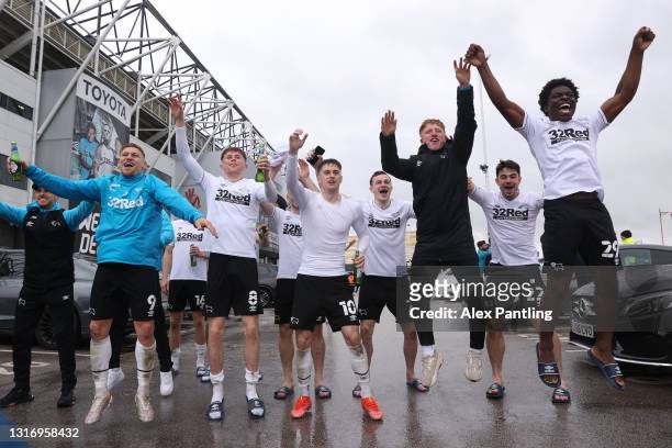 Players of Derby County celebrate their side's safety outside the ground after the Sky Bet Championship match between Derby County and Sheffield...