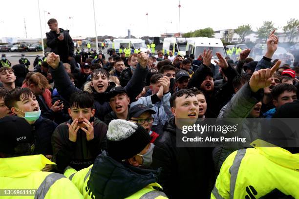 Derby County fans celebrate outside the stadium as their side secure league safety after the Sky Bet Championship match between Derby County and...