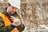 geologist examines a mineral sample