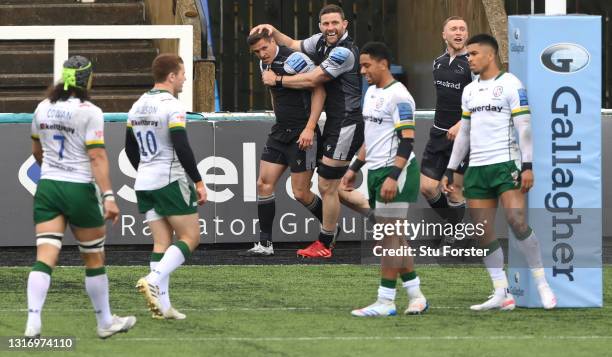 Falcons ty scorer Louis Schreuder is congratulated by Mark Wilson during the Gallagher Premiership Rugby match between Newcastle Falcons and London...