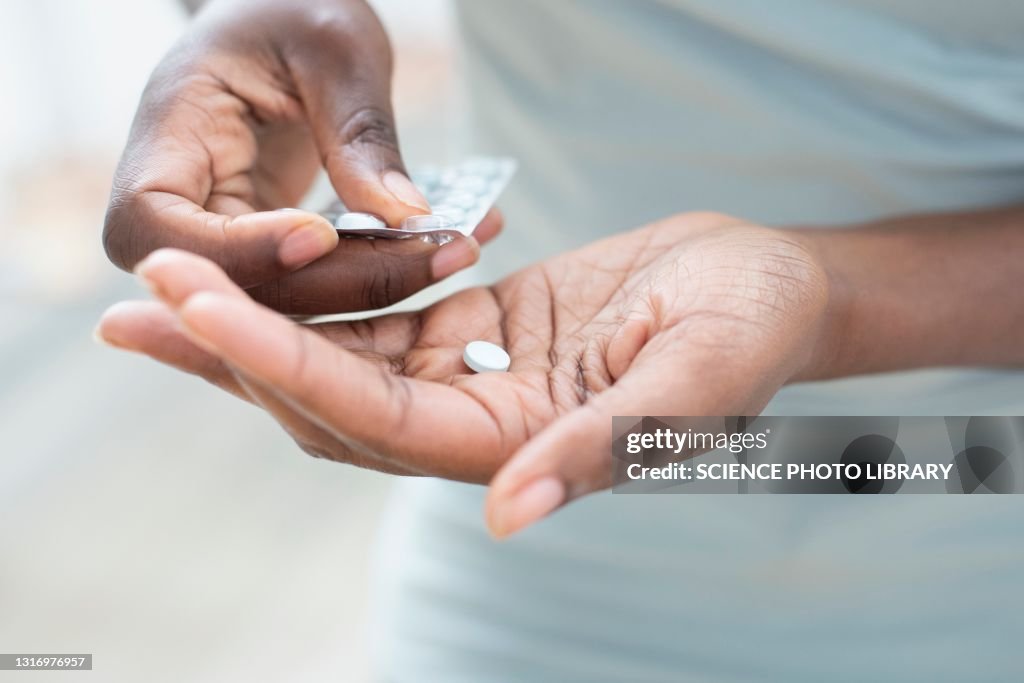 Woman taking pills