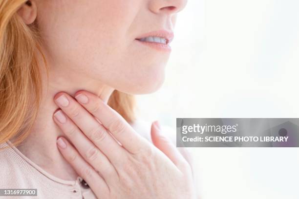 woman with sore throat - throat stock pictures, royalty-free photos & images