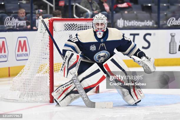 Goaltender Matiss Kivlenieks of the Columbus Blue Jackets defends the net against the Detroit Red Wings at Nationwide Arena on May 7, 2021 in...