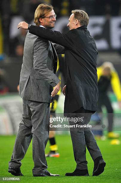 Juergen Klopp, head coach of Dortmund greets Hans Joachim Watzke during the UEFA Champions League group F match between Borussia Dortmund and...
