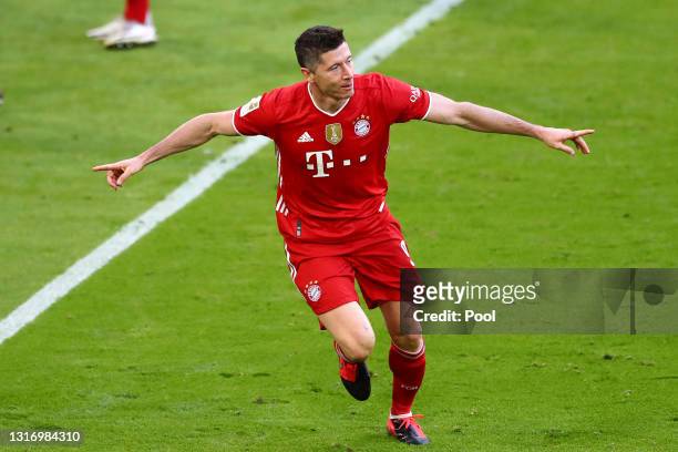Robert Lewandowski of FC Bayern Muenchen celebrates after scoring their side's third goal during the Bundesliga match between FC Bayern Muenchen and...