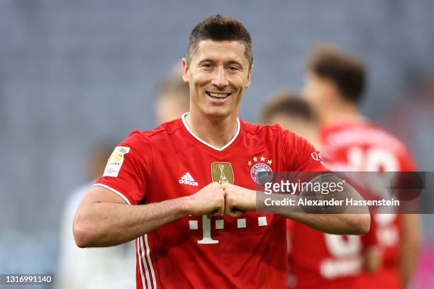 Robert Lewandowski of FC Bayern Muenchen celebrates after scoring their side's fifth goal during the Bundesliga match between FC Bayern Muenchen and...