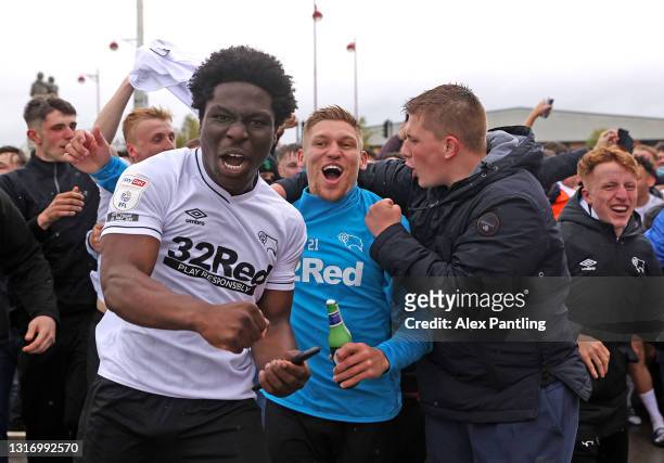 Martyn Waghorn of Derby County celebrates with fans outside the stadium as they secure safety in the Championship the Sky Bet Championship match...