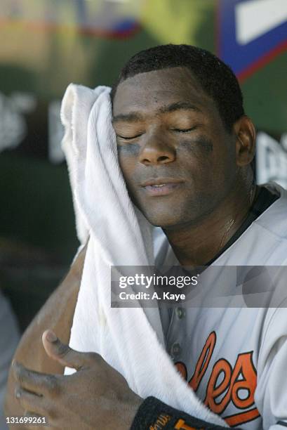 Baltimore Orioles shortstop Miguel Tejada sits in the dugout during the 7-6 win over the Texas Rangers at Ameriquest Stadium in Arlington, Texas on...