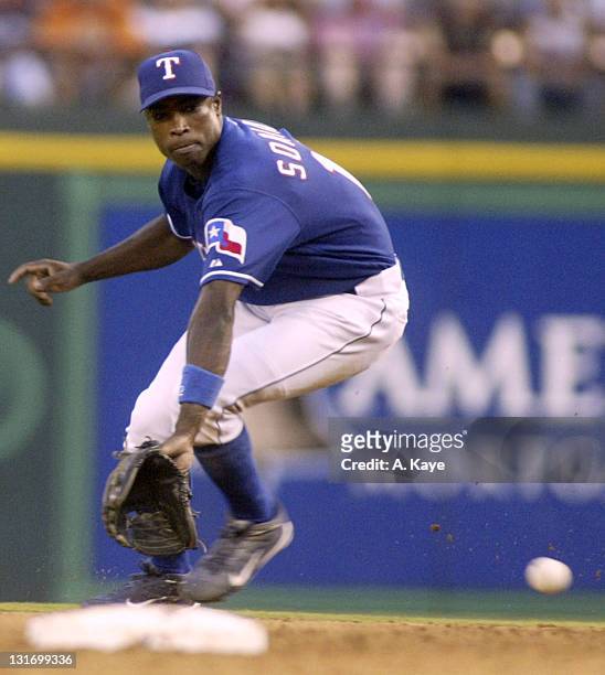 Second baseman Alfonso Soriano of the Texas Rangers draws a bead on a Bernie Williams ground ball. Unfortunately the ball went through his legs for a...