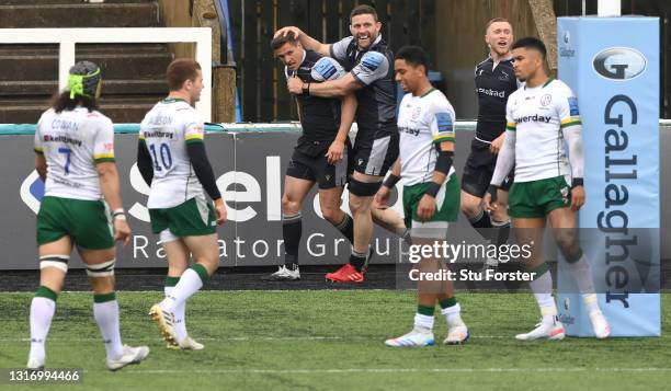 Falcons try scorer Louis Schreuder is congratulated by Mark Wilson during the Gallagher Premiership Rugby match between Newcastle Falcons and London...