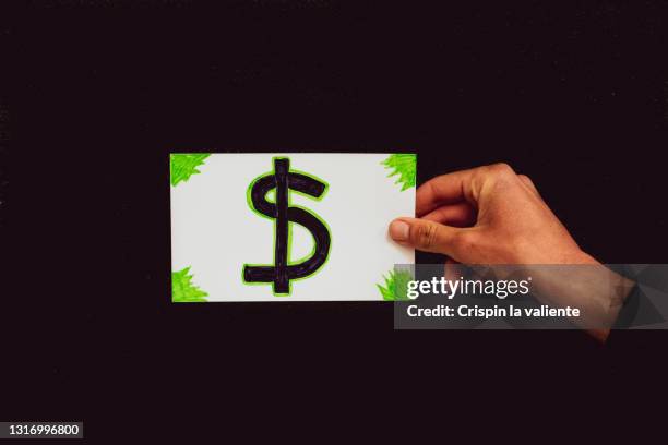 drawing of dollar symbol on black background - dollar sign photos et images de collection