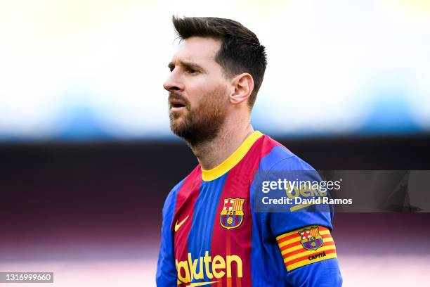 Lionel Messi of FC Barcelona looks on during the La Liga Santander match between FC Barcelona and Atletico de Madrid at Camp Nou on May 08, 2021 in...