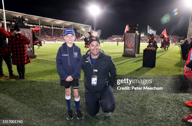 The ball boy who takes the ball onto the field with the Crusaders pictured with his dad before the Super Rugby Aotearoa Final match between the...