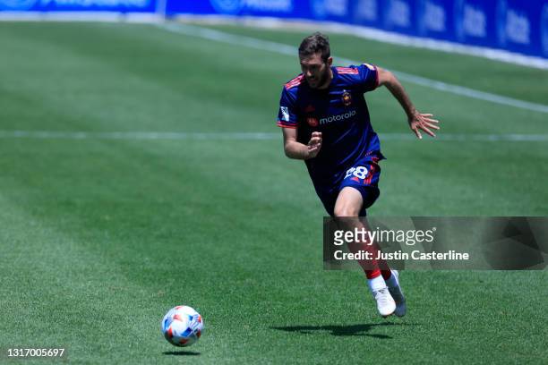 Elliot Collier of the Chicago Fire brings the ball up the field in the game against the Philadelphia Union during the first half at Soldier Field on...