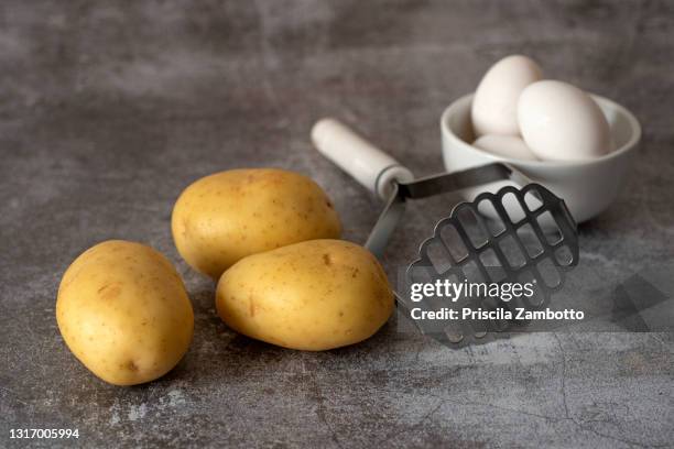 potatoes and eggs - potato masher stock pictures, royalty-free photos & images