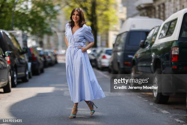 Anna Wolfers wearing blue midi dress and green heels on May 01, 2021 in Hamburg, Germany.