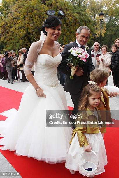 Macarena Pescador and her father arrive at Santo Domingo de Silos church on November 5, 2011 in Pinto, Spain.