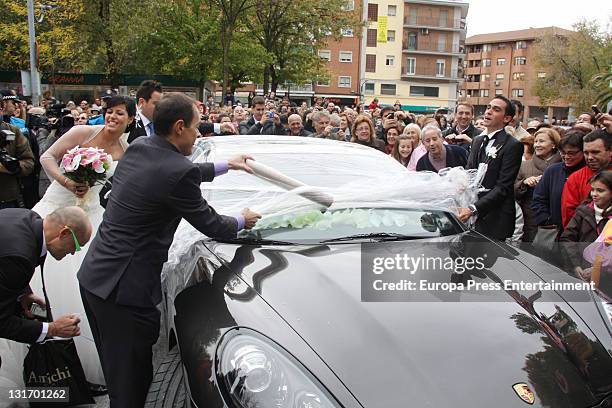 Three-time Tour de France champion Alberto Contador takes film off his car after his friends play a joke on him during his wedding at Santo Domingo...