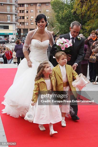 Macarena Pescador and her father arrive at Santo Domingo de Silos church on November 5, 2011 in Pinto, Spain.