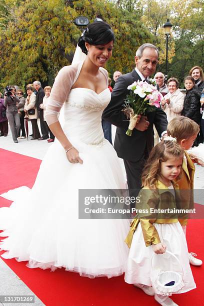 Macarena Pescador and her father arrive at Santo Domingo de Silos church on November 5, 2011 in Pinto, Spain.