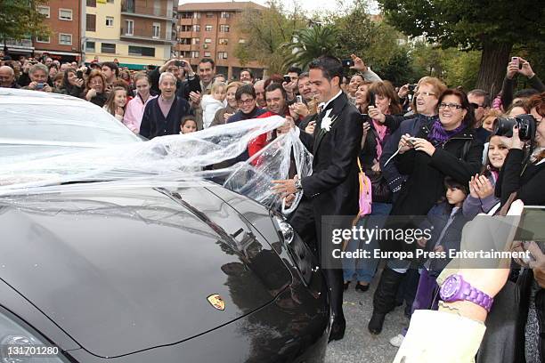 Three-time Tour de France champion Alberto Contador takes film off his car after his friends play a joke on him during his wedding at Santo Domingo...