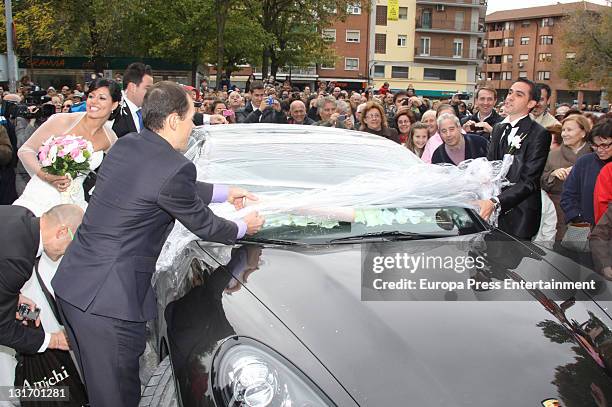 Three-time Tour de France champion Alberto Contador takes film off his car after his friends play a joke on him during his wedding at Santo Domingo...