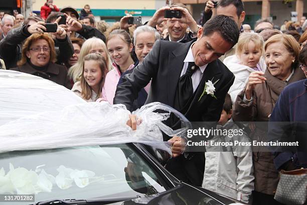 Three-time Tour de France champion Alberto Contador takes film off his car after his friends play a joke on him during his wedding at Santo Domingo...