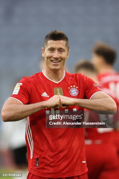 Robert Lewandowski of FC Bayern Muenchen celebrates after scoring their side's fifth goal during the Bundesliga match between FC Bayern Muenchen and...