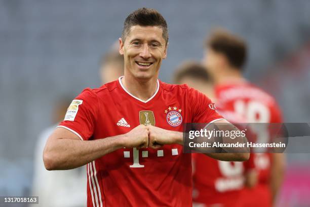 Robert Lewandowski of FC Bayern Muenchen celebrates after scoring their side's fifth goal during the Bundesliga match between FC Bayern Muenchen and...