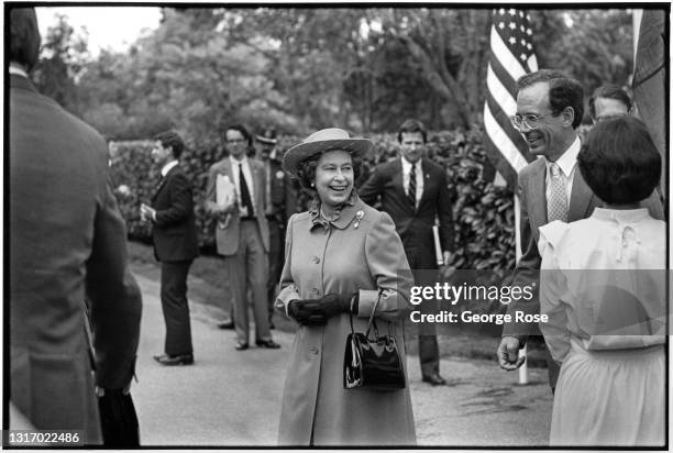 Queen Elizabeth II departs Hoover House following lunch at Stanford University during her West Coast tour of the United States accompanied by Prince...