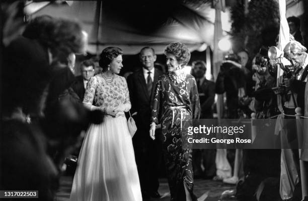 Queen Elizabeth II and Prince Philip join Nancy Reagan during a red carpet celebrity-filled event at 20th Century Fox studios on February 27, 1983 in...