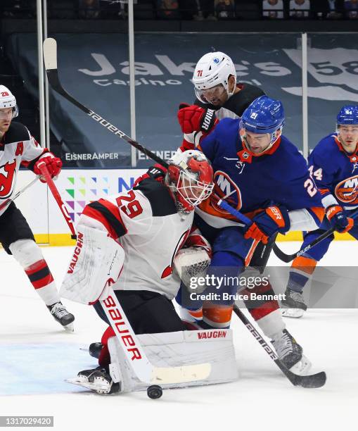 Mackenzie Blackwood of the New Jersey Devils makes the second period save on Kyle Palmieri of the New York Islanders at the Nassau Coliseum on May...