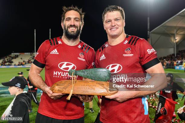 Samuel Whitelock and captain Scott Barrett of the Crusaders pose with the Tū Kōtahi Aotearoa trophy after their win in the Super Rugby Aotearoa Final...