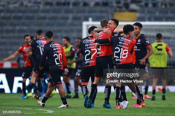 Players of Atlas celebrate after winning the playoff match between Atlas and Tigres UANL as part of the Torneo Guard1anes 2021 Liga MX at Jalisco...