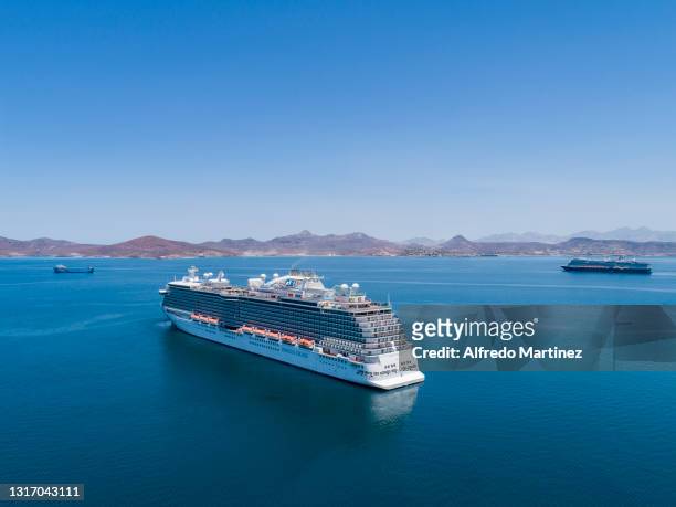 Passenger cruise ship of the Princess company and one more of the Holland America Line company are anchored on the outskirts of the Bay of Paz,...