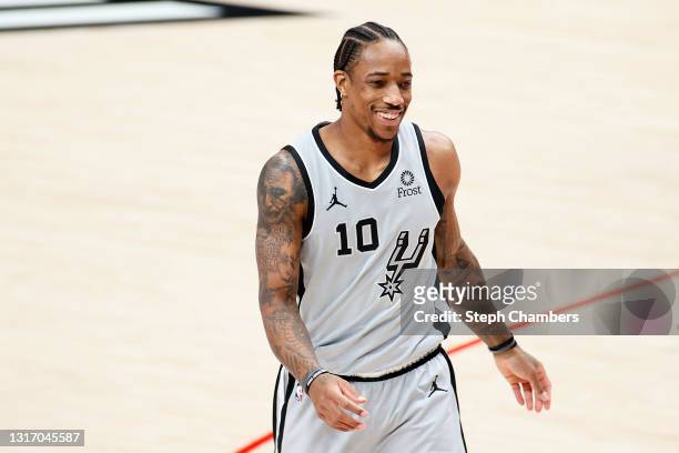 DeMar DeRozan of the San Antonio Spurs looks on during the first quarter against the Portland Trail Blazers at Moda Center on May 08, 2021 in...