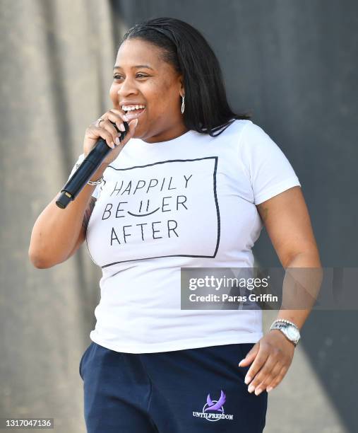 Rev. Marissa Fowler speaks onstage during Ahmaud Arbery Foundation Kick Off & Drive Up Birthday Bash at New Birth Missionary Baptist Church on May...