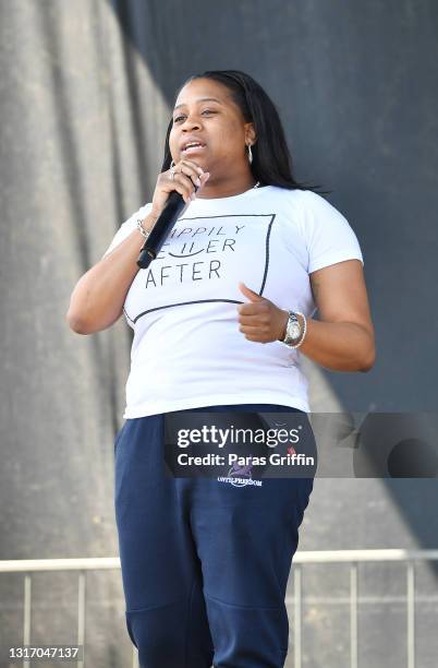 Rev. Marissa Fowler speaks onstage during Ahmaud Arbery Foundation Kick Off & Drive Up Birthday Bash at New Birth Missionary Baptist Church on May...
