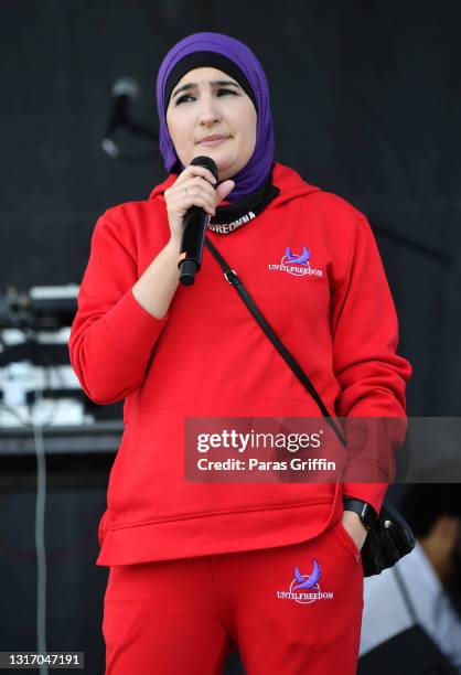 Activist Linda Sarsour speaks onstage during Ahmaud Arbery Foundation Kick Off & Drive Up Birthday Bash at New Birth Missionary Baptist Church on May...