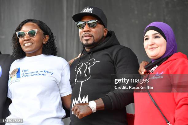 Wanda Cooper Jones, Jeezy and Linda Sarsour onstage during Ahmaud Arbery Foundation Kick Off & Drive Up Birthday Bash at New Birth Missionary Baptist...