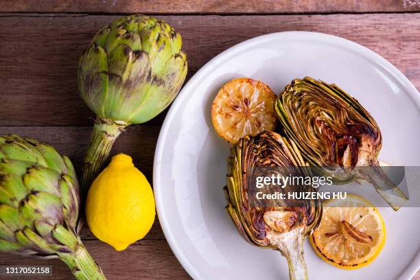 grilled artichokes roasted - artichoke stock pictures, royalty-free photos & images