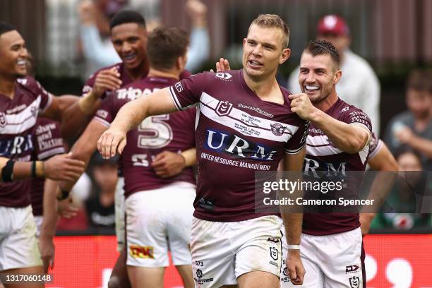 Kieran Foran of the Sea Eagles celebrates with Tom Trbojevic of the Sea Eagles following a try by team mate Jason Saab of the Sea Eagles during the...