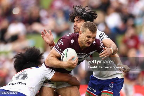 Tom Trbojevic of the Sea Eagles is tackled during the round nine NRL match between the Manly Sea Eagles and the New Zealand Warriors at Lottoland, on...