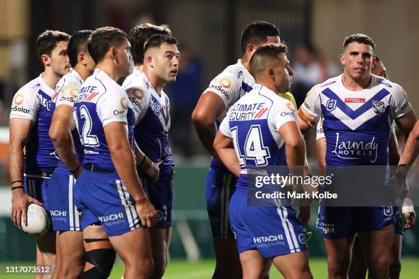 Nick Cotric of the Bulldogs and his team mates looks dejected after a try during the round nine NRL match between the St George Illawarra Dragons and...