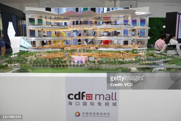 People visit CDF mall booth during the first China International Consumer Products Expo at Hainan International Convention and Exhibition Center on...